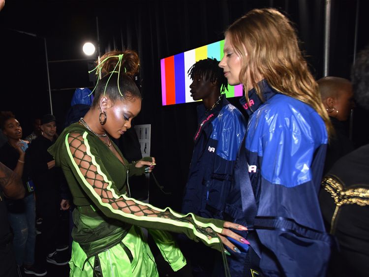 RiRi prepares models backstage at the FENTY PUMA by Rihanna Spring/Summer 2018 Collection