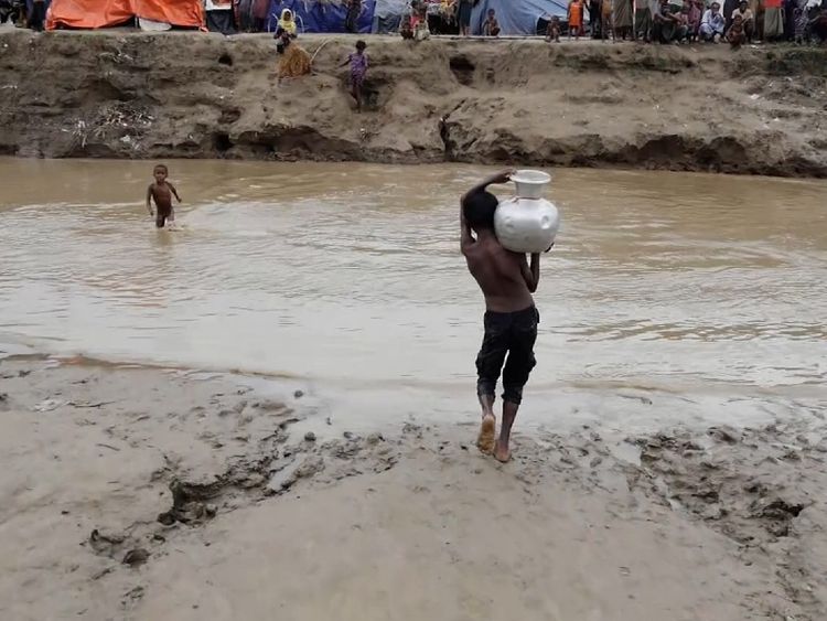 Only children are allowed to cross the creek in order to get clean drinking water