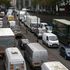 Vehicles wait in a traffic jam