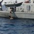The woman can be seen boarding a rescue ship in he Adriatic Sea on Sunday