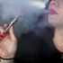 MIAMI, FL - APRIL 24: Julia Boyle enjoys an electronic cigarette as she waits for customers at the Vapor Shark store on April 24, 2014 in Miami, Florida. Brandon Leidel, CEO, Director of Operations.Vapor Shark, said he welcomes the annoucement by the Food and Drug Administration that they are proposing the first federal regulations on electronic cigarettes, which would ban sales of the popular devices to anyone under 18 and require makers to gain FDA approval for their products. (Photo by Joe Raedle/Getty Images)