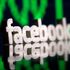 A 3D-printed Facebook logo is seen in front of displayed stock graph in this illustration photo March 20, 2018. Picture taken March 20