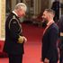 Tom Hardy laughs with Prince Charles as he is made CBE