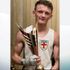 A man has been arrested over the murder of boxer Tom Bell