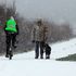 A man walks his dog through the snow in Whitley Bay, North Tyneside