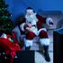 Santa Claus watches some television at Christmas