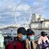 A couple wear face masks as they walk along the Thames embankment in central London on January 28, 2020. - Around 1,500 people who came to Britain from the Chinese epicentre of the coronavirus epidemic in the past two weeks must put themselves in isolation, the UK health minister has said. (Photo by Justin TALLIS / AFP) (Photo by JUSTIN TALLIS/AFP via Getty Images)