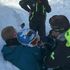 Fox hugs his dad after being pulled from the snow. Pic: La Chamoniarde