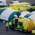 London Ambulance Service workers outside the new NHS Nightingale hospital