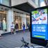 Shoppers queue beside covid advice posters in Bristol as non-essential shops in England open their doors to customers for the first time since coronavirus lockdown restrictions were imposed in March.
