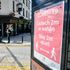 A covid-19 poster opposite a pub in Merthyr Tydfil, Wales