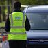 An NHS worker is seen wearing a Test and Trace jacket at Lee Valley Athletics Centre in Edmonton