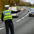 Police pull over cars at a checkpoint during Wales's 'fire break' lockdown