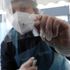 A swab is taken at a testing facility at Gatwick