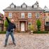 Undated handout photo issued by Omaze of Ian Garrick, a civil servant from Mablethorpe, Lincolnshire, outside the £1 million pound house in Cheadle Hulme, Cheshire he won as part of a charity draw in aid of Teenage Cancer Trust.