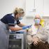 Peter Cast, 87, receives his vaccine at a Superdrug store in Guildford, Surrey