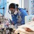 A specialist nurse checks on a COVID-19 patient at the Royal Papworth Hospital, Cambridge