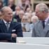 Britain's Prince Philip and Prince Charles listen to speeches before the unveiling of a statue of Queen Elizabeth The Queen Mother in Poundbury