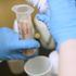 A milky formula rich in calories and nutrients is put into large syringes