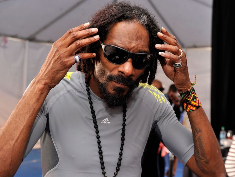 Rapper Snoop Dogg attends GBK and DirecTV Celebrity Beach Bowl Thank You Lounge at DTV SuperFan Stadium at Mardi Gras World