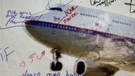 A message left on a board of remembrance by the wife of a passenger aboard missing Malaysia Airlines Flight MH370, at a vigil ahead of the one-year anniversary of its disappearance in Kuala Lumpur