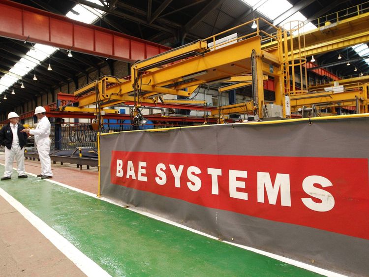 Workmen stand in the BAE Systems' Govan shipyard in Glasgow