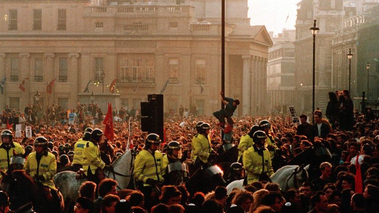 A crowd gathered in Trafalgar Square, London, protesting against the poll tax in 1990