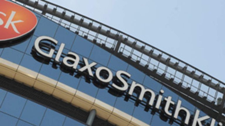 Signage is pictured on the company headquarters of GlaxoSmithKline in west London