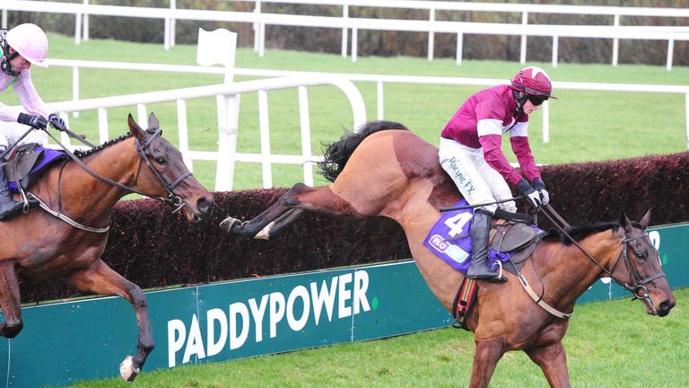 Outlander ridden by Bryan Cooper (right) leads Pont Alexandre ridden by Ruby Walsh over the last fence before winning the Flogas Novice Chase during the Ir