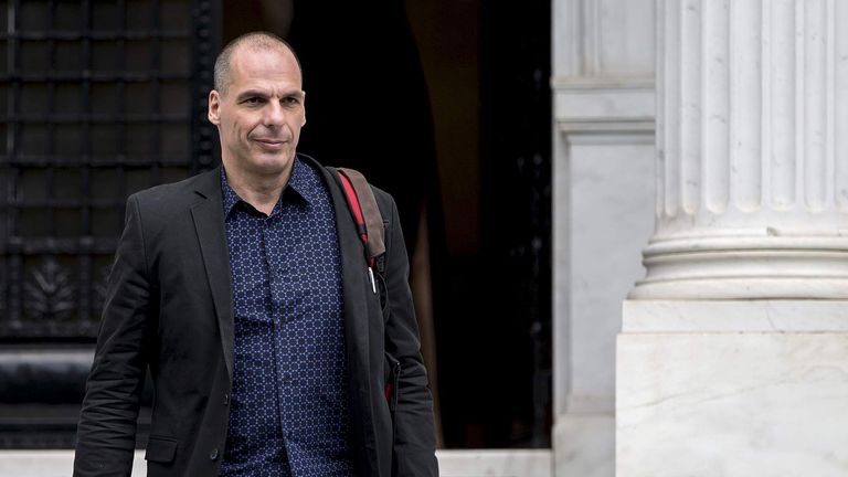 Greek Finance Minister Yanis Varoufakis leaves after a meeting at the office of Prime Minister Alexis Tsipras at Maximos Mansion in Athens