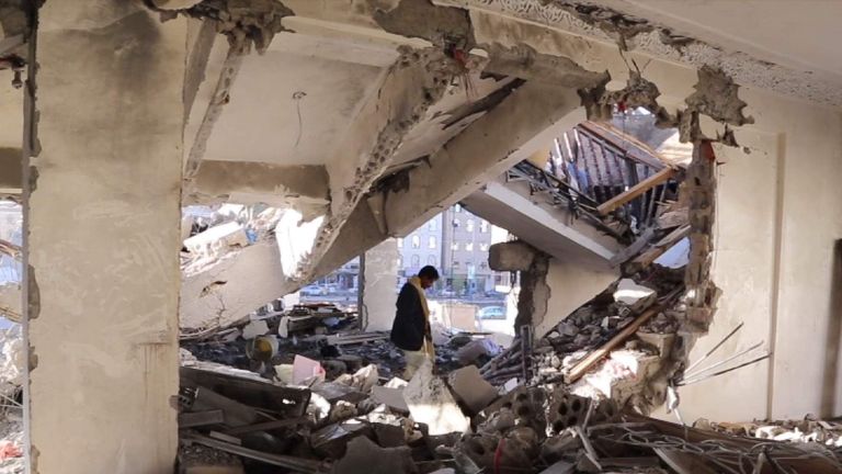 Yemen - Sadiq Rubeid inspects the ruins of his family's home