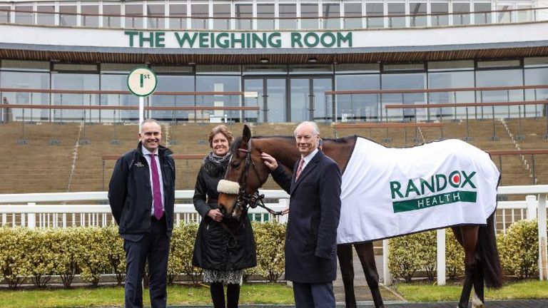 L-R:-Aintree's MD John Baker, Aintree Chairman Rose Paterson and Dr Peter FitzGerald CBE, Founder and Managing Director of Randox at Aintree