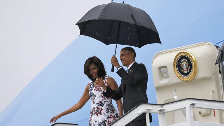 U.S. President Barack Obama and his wife Michelle exit Air Force One at Havana's airport