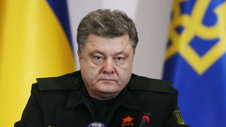 Ukraine's President Petro Poroshenko talks to military staff in Kiev