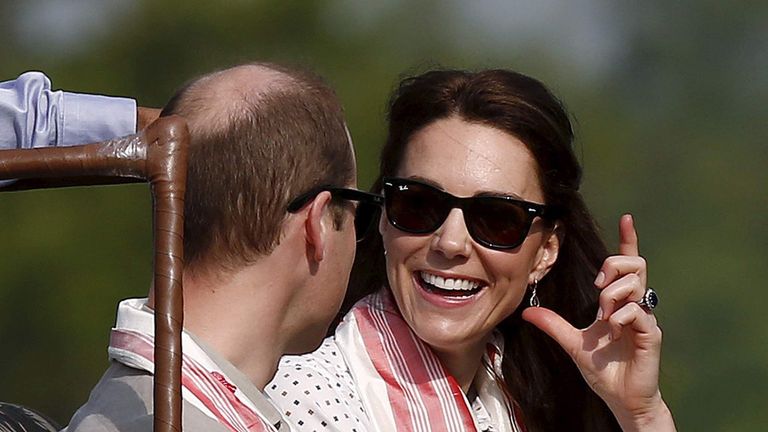 Britain's Catherine, Duchess of Cambridge, shares a moment with her husband Prince William as they sit in a jeep while on a safari at Kaziranga in Assam