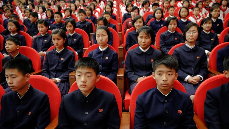 Spectators wait for the beginning of a performance at the Mangyongdae Children's Palace in Pyongyang