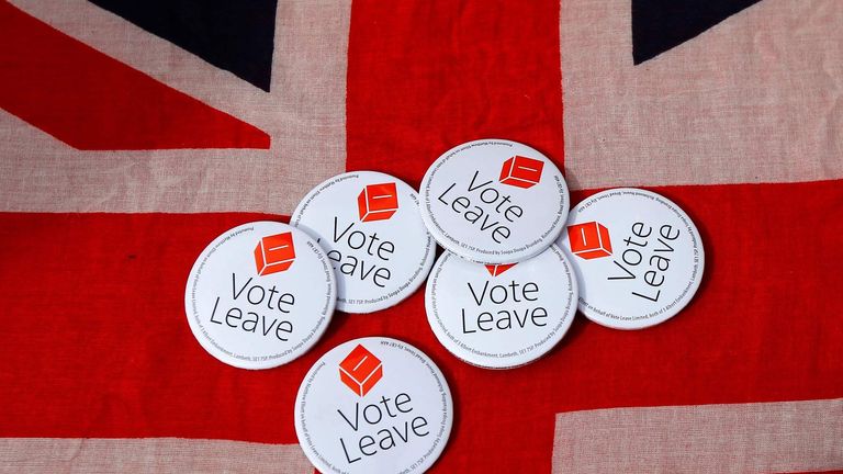 Badges are displayed on a Union flag during a Vote Leave rally in Exeter