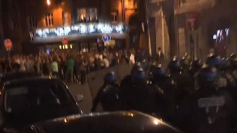 Police charge England fans in Lille.
