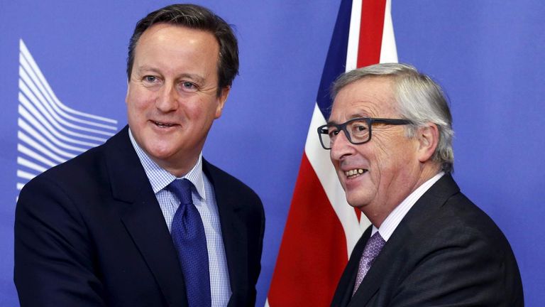David Cameron poses with EU Commission President Jean-Claude Juncker in Brussels.