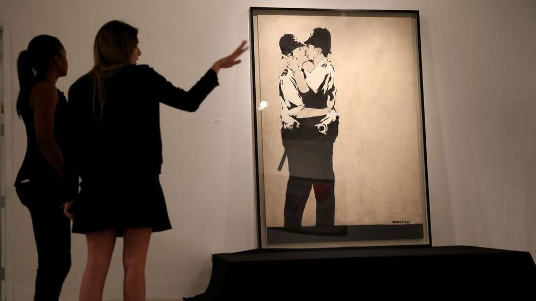 Kissing Coppers By Banksy Sold At Us Auction Ents And Arts News Sky News