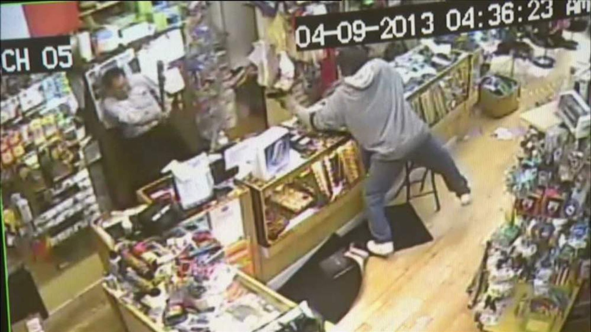 Convenience store owner fights off robber with baseball bat