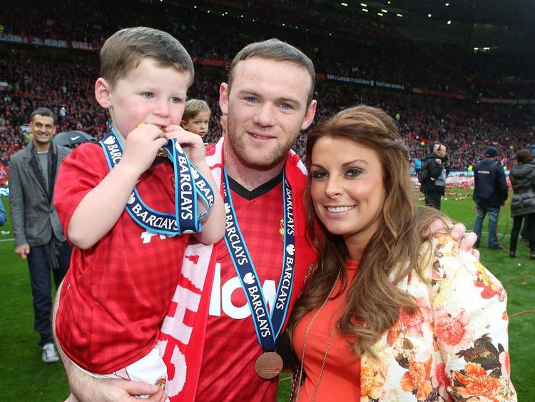 Wayne Rooney, with wife Coleen and son Kai