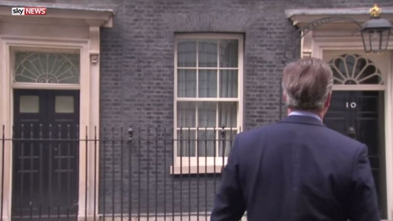 The PM sings to himself as he walks back into Number 10 after announcing he will be out in two days