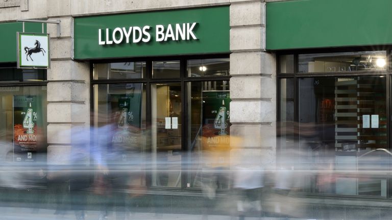 People was past a branch of Lloyds bank in central Londo