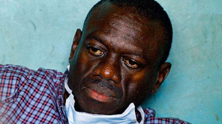 Ugandan opposition leader Kizza Besigye looks on at the Kasangati police station after being arrested close to his house on April 11, 2011