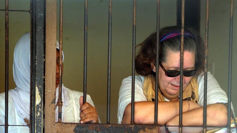Lindsay June Sandiford (R) of Britain reacts inside a holding cell after her trial