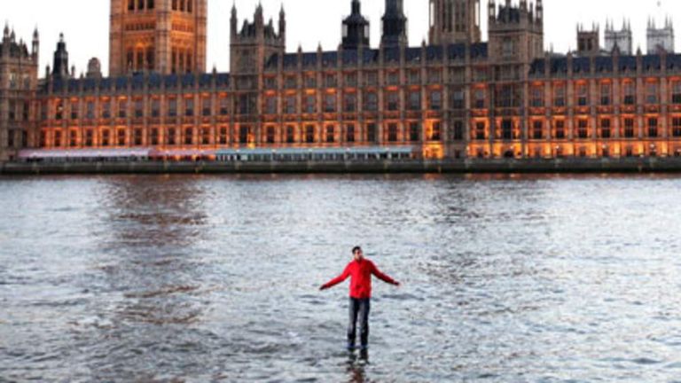 magician Dynamo 'walks on water' across the River Thames, London 