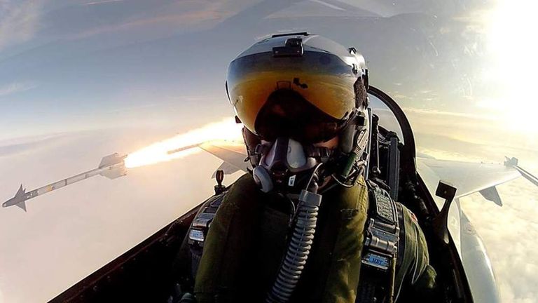 A Danish fighter pilot takes a selfie in an F-16 whilst launching a sidewinder missile.