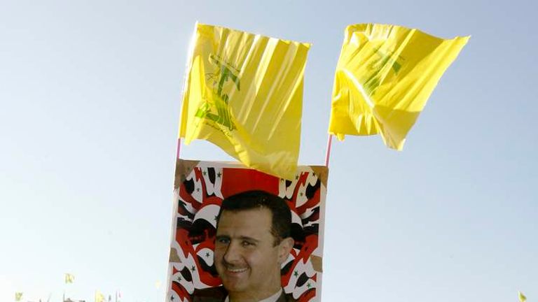 Hizbollah leader Hasan Nasrallah (bottom) and Syrian President Bashar al Assad