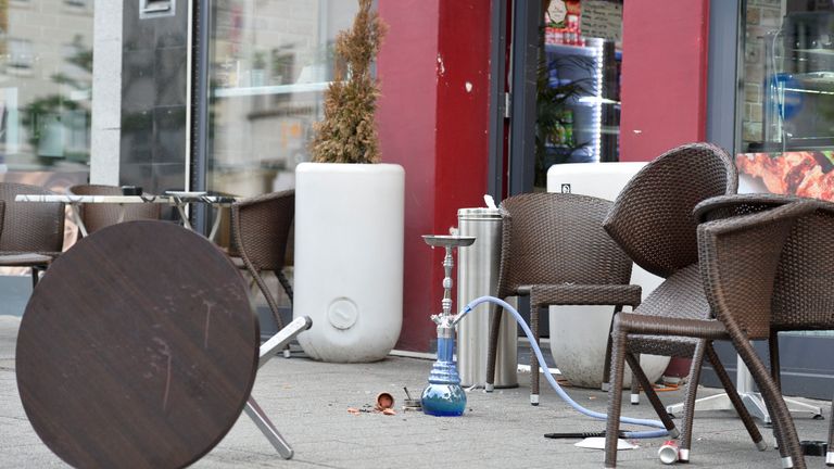 Chairs and a table in front of a restaurant in Reutlingen, Germany, where a Syrian asylum-seeker killed a woman and injured two people with a machete